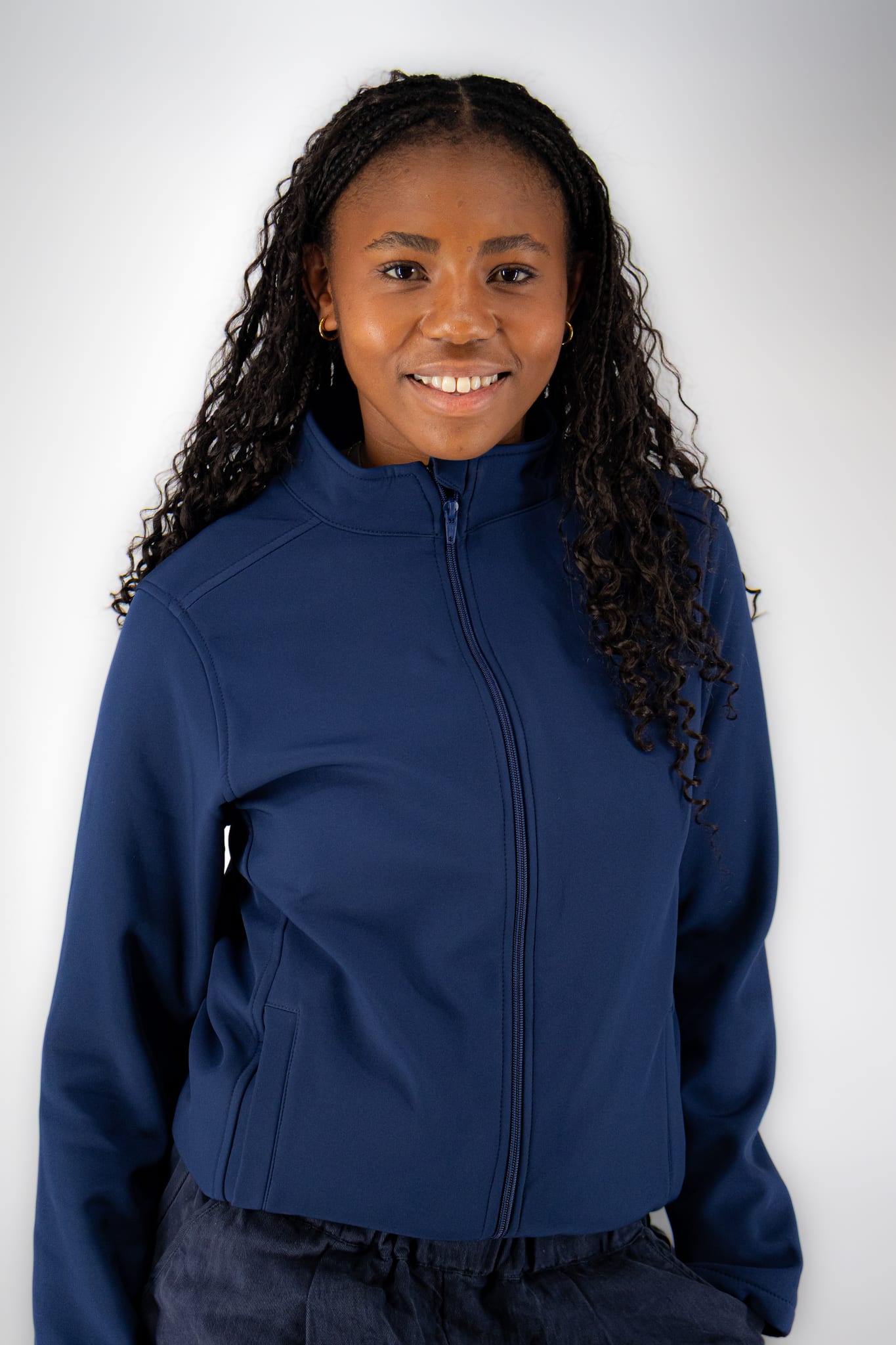 Woman wearing the navy WiZscrubs Comfort Jacket