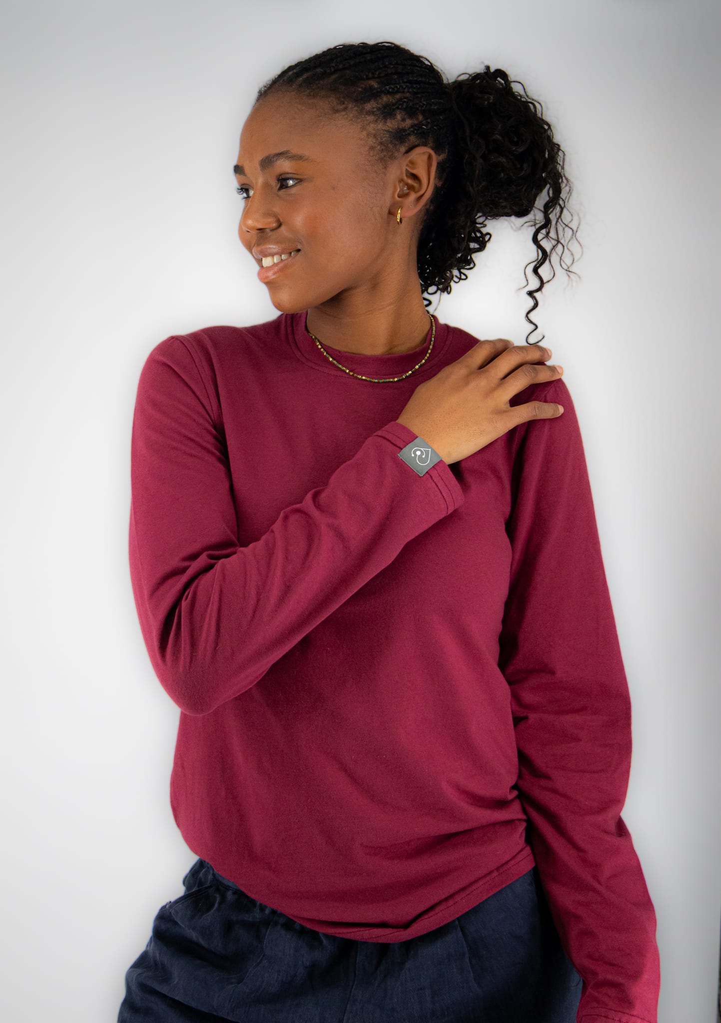 Woman wearing a maroon long-sleeve underscrub