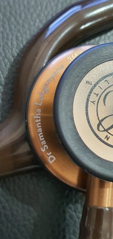 Copper Littmann chestpiece engraved with a doctor's name in script