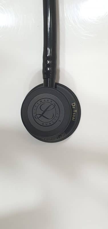 Black-finish Littmann chestpiece with a small engraved name on the rim