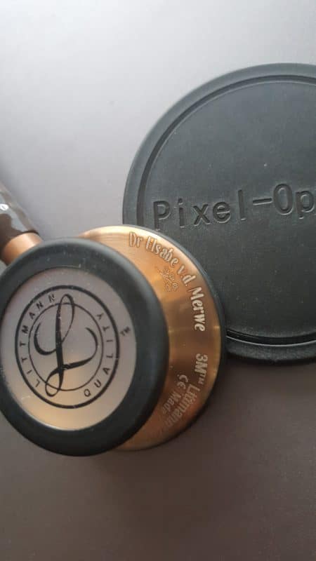 Copper Littmann chestpiece engraved with a name in the Cursive font