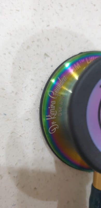 Rainbow-finish Littmann chestpiece engraved with a doctor's name in the Cursive font