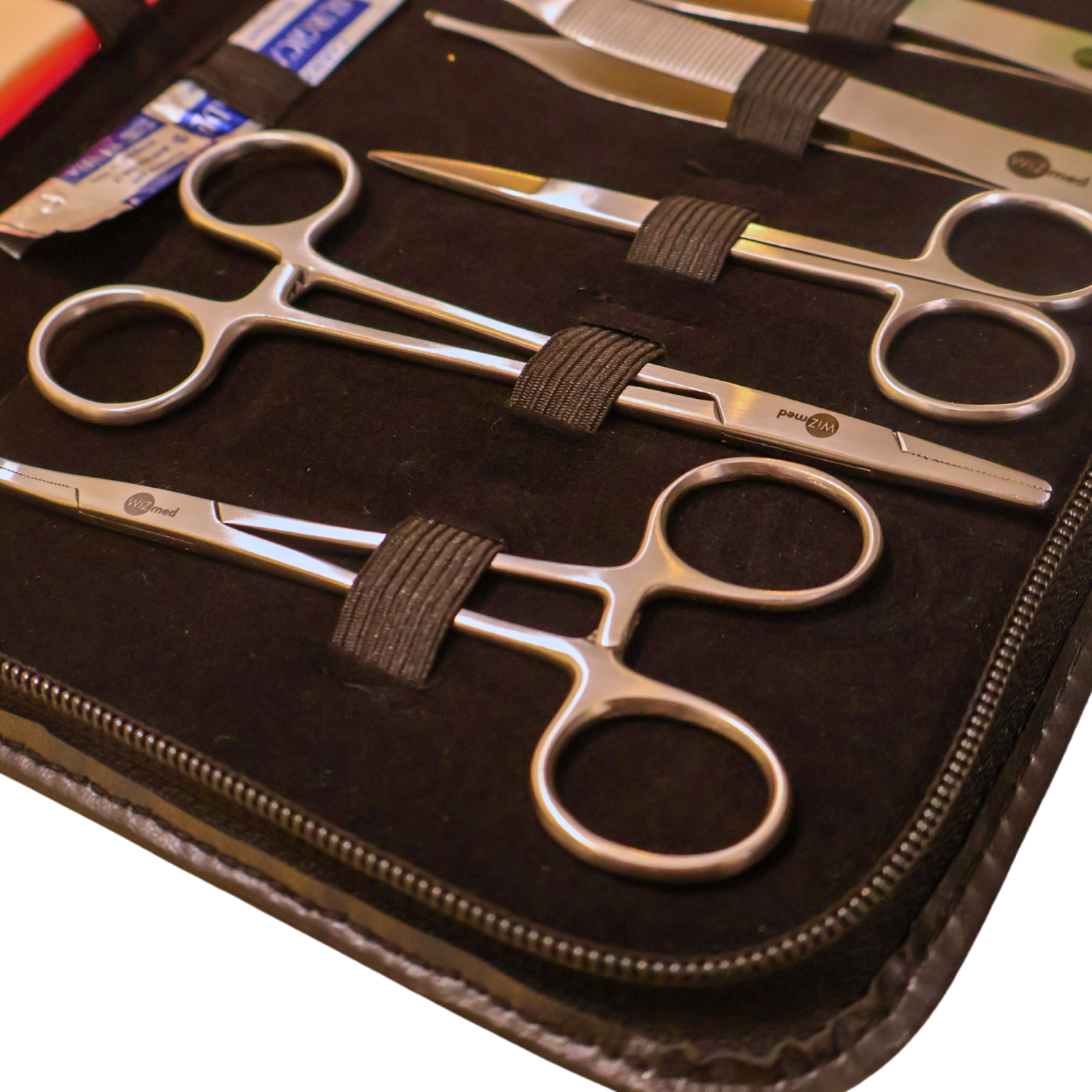 Close-up of the WiZmed suture kit needle holder and forceps