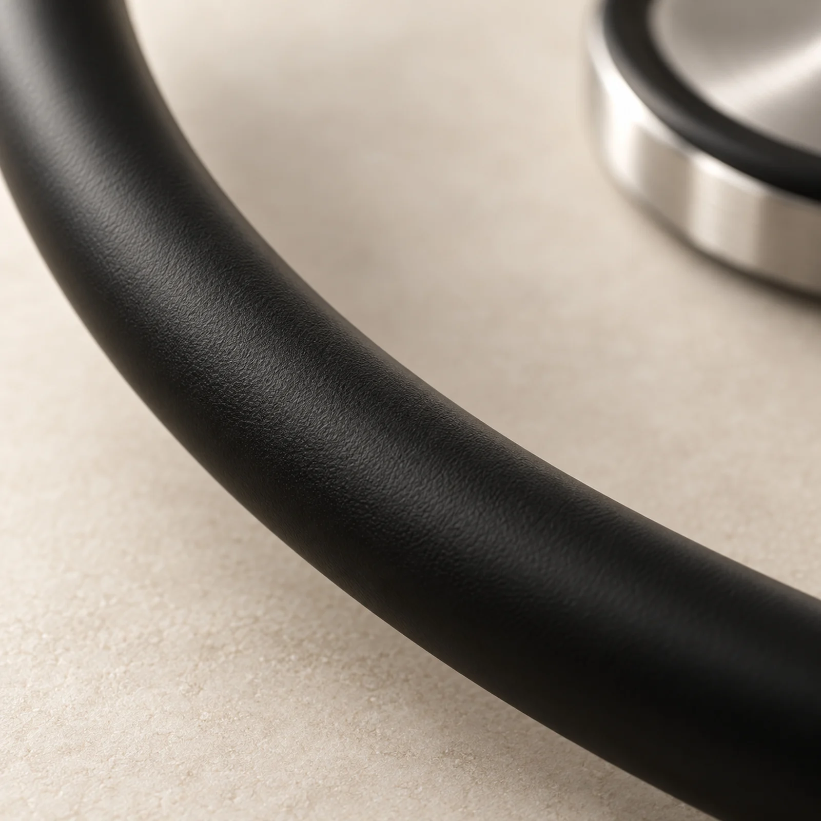 Black satin-finish tubing, close up