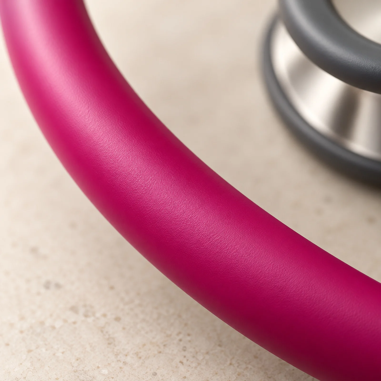 Raspberry satin-finish tubing, close up