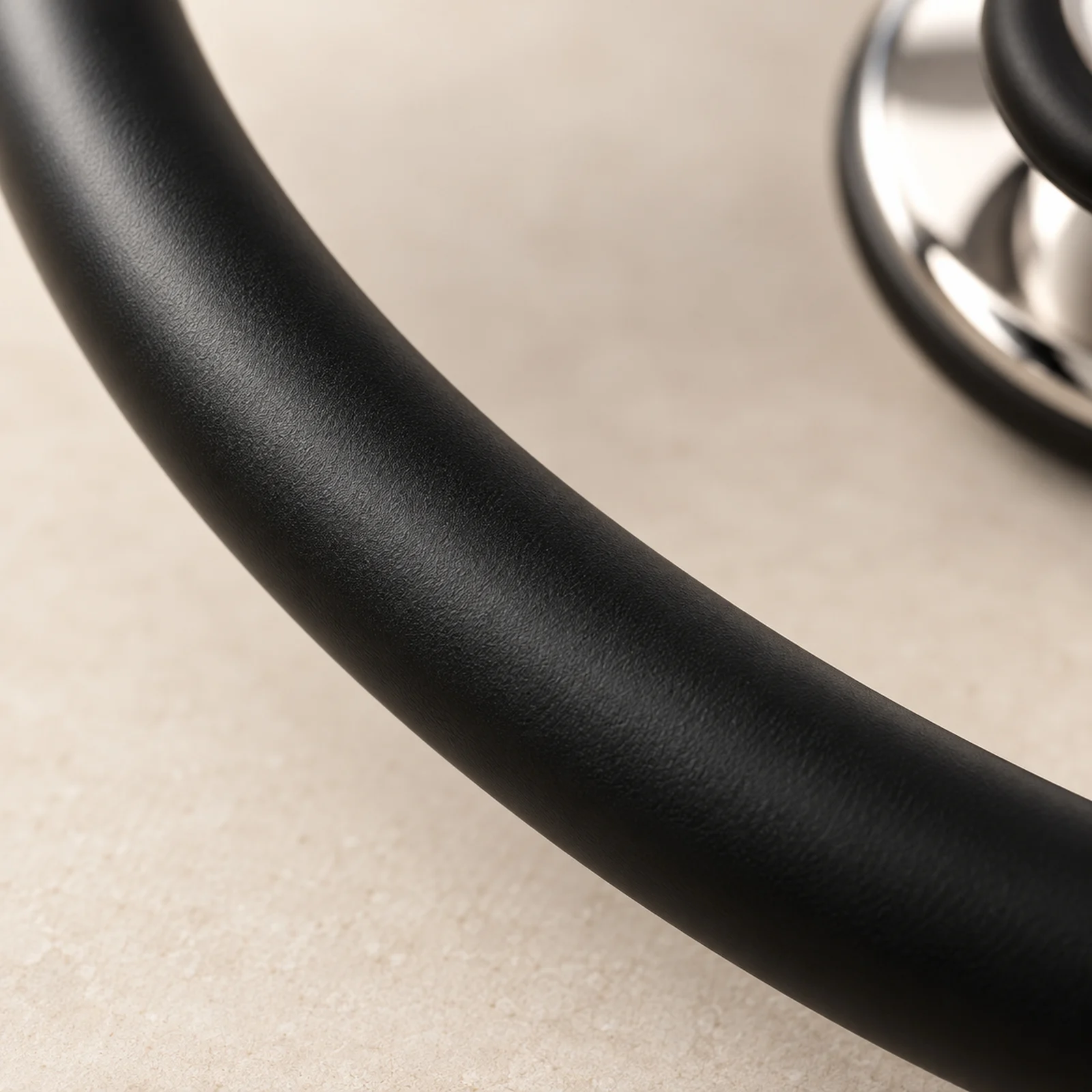 Black satin-finish tubing, close up